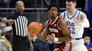 Mar 8, 2025; Pittsburgh, Pennsylvania, USA;  Boston College Eagles guard Joshua Beadle (7) handles the ball as Pittsburgh Panthers guard Amsal Delalic (52) defends during the first half at the Petersen Events Center. Mandatory Credit: Charles LeClaire-Imagn Images