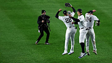 Oct 14, 2024; Bronx, New York, USA; New York Yankees outfielder Juan Soto (22), outfielder Aaron Judge (99) and outfielder Alex Verdugo (24) celebrates after defeating the Cleveland Guardians in game one of the ALCS for the 2024 MLB Playoffs at Yankee Stadium.
