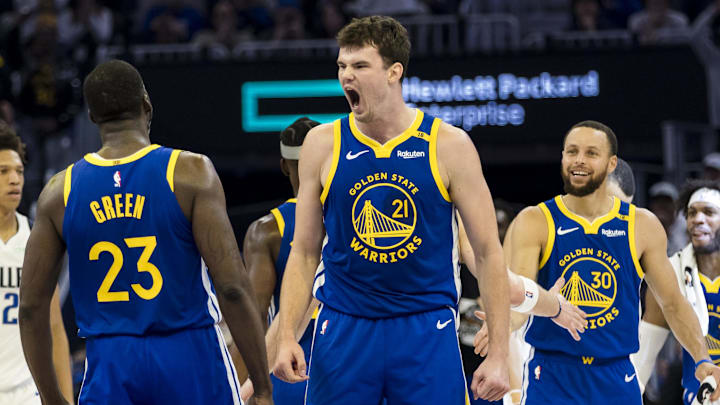 Feb 23, 2025; San Francisco, California, USA; Golden State Warriors center Quinten Post (21) reacts after he scored against the Dallas Mavericks during the second quarter at Chase Center. Mandatory Credit: John Hefti-Imagn Images