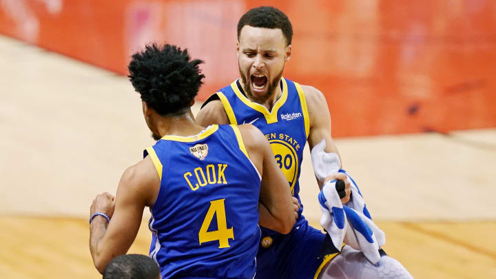 Golden State Warriors guard Quinn Cook (4) and Golden State Warriors guard Stephen Curry (30) celebrate during a time out in the fourth quarter against the Toronto Raptors in game two of the 2019 NBA Finals at Scotiabank Arena. Mandatory Credit: