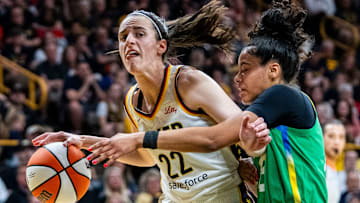 Indiana Fever guard Caitlin Clark (22) takes the ball to the basket against Brazilian National Team guard Tainá Mayor da Paixão (8) on Sunday, May 4, 2025, during a preseason game between the Indiana Fever and the Brazil national team at Carver-Hawkeye Arena in Iowa City.