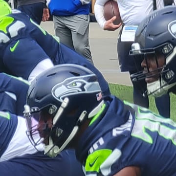 The Seahawks offensive line prepares for a run fit walkthrough drill. From left to right, McClendon Curtis, Olu Oluwatimi, Laken Tomlinson, and Charles Cross.
