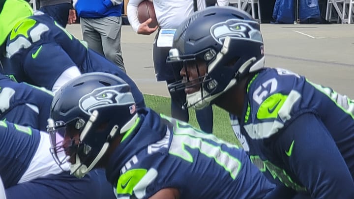 The Seahawks offensive line prepares for a run fit walkthrough drill. From left to right, McClendon Curtis, Olu Oluwatimi, Laken Tomlinson, and Charles Cross.