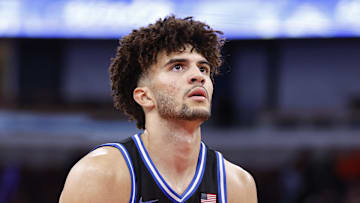 Nov 27, 2025; Chicago, Illinois, USA; Duke Blue Devils forward Cameron Boozer (12) shoots a free throw against the Arkansas Razorbacks during the second half at United Center. Mandatory Credit: Kamil Krzaczynski-Imagn Images