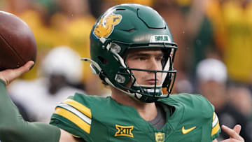 Nov 1, 2025; Waco, Texas, USA; Baylor Bears quarterback Sawyer Robertson (13) throws downfield against the UCF Knights during the first half at McLane Stadium. Mandatory Credit: Raymond Carlin III-Imagn Images