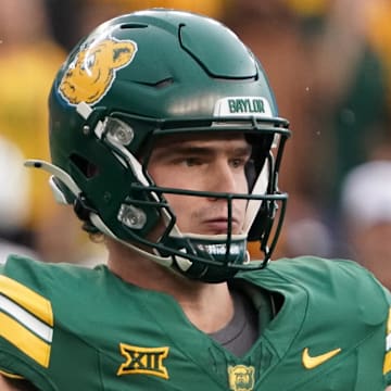 Nov 1, 2025; Waco, Texas, USA; Baylor Bears quarterback Sawyer Robertson (13) throws downfield against the UCF Knights during the first half at McLane Stadium. Mandatory Credit: Raymond Carlin III-Imagn Images