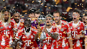 Bayern Munich players celebrating DFL Super Cup win against VfB Stuttgart.