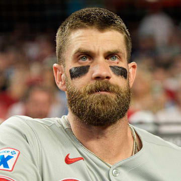 Sep 19, 2025; Phoenix, Arizona, USA;  Philadelphia Phillies infielder Bryce Harper (3) watches on from the dugout before his first at bat of the game against the Arizona Diamondbacks at Chase Field. Mandatory Credit: Allan Henry-Imagn Images