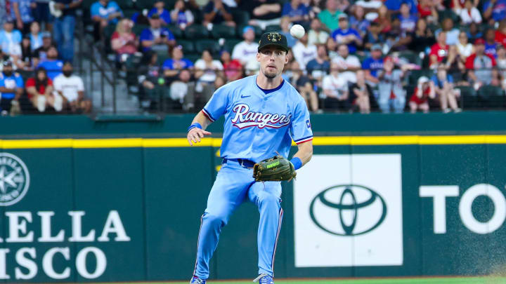 Texas Rangers outfielder Evan Carter (32) cannot catch a ball during the seventh inning against the Los Angeles Angels at Globe Life Field on May 19.