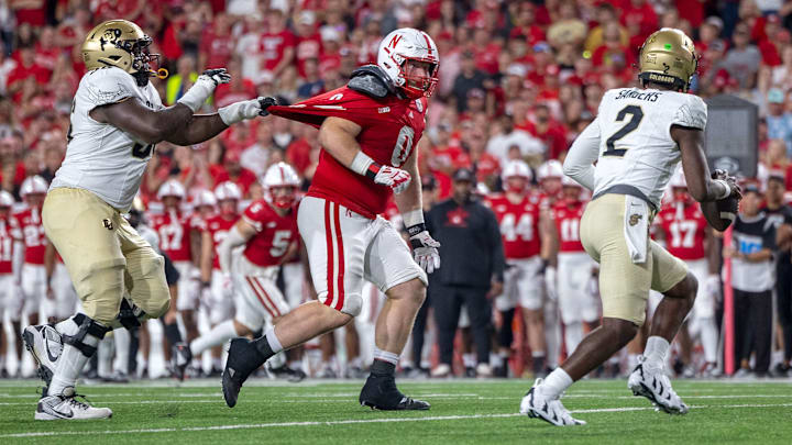 Nebraska defensive lineman Nash Hutmacher chases after Colorado quarterback Shedeur Sanders during the third quarter. Holding was not called on the play.