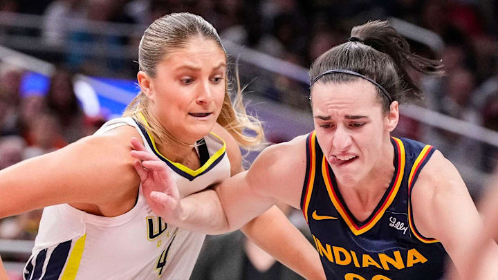 Indiana Fever guard Caitlin Clark rushes up the court against Dallas Wings guard Jacy Sheldon. Indiana Fever guard Caitlin Clark rushes up the court against Dallas Wings guard Jacy Sheldon.