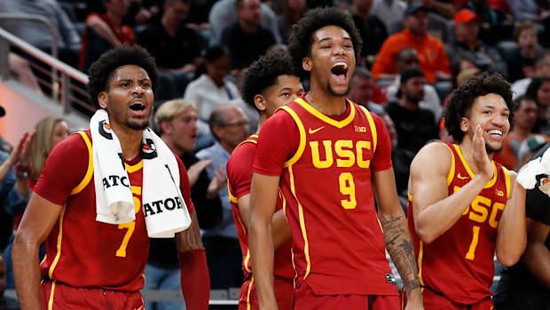 The USC Trojans bench celebrates Thursday, March 13, 2025, during the Big Ten Men’s Basketball Tournament game against the Pu