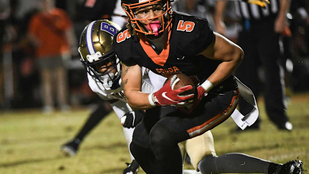 Jayvan Boggs of the Cocoa Tigers catches a pass in the FHSAA football Class 2S state semifinal game against Booker in 2023. 