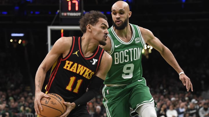 Feb 7, 2024; Boston, Massachusetts, USA;  Atlanta Hawks guard Trae Young (11) controls the ball while Boston Celtics guard Derrick White (9) defends during the first half at TD Garden. Mandatory Credit: Bob DeChiara-USA TODAY Sports