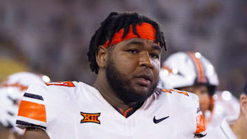 Sep 9, 2023; Tempe, Arizona, USA; Oklahoma State Cowboys offensive lineman Noah McKinney (77) against the Arizona State Sun Devils at Mountain America Stadium. Mandatory Credit: Mark J. Rebilas-Imagn Images