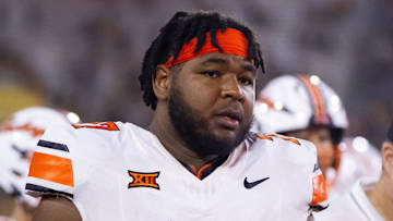 Sep 9, 2023; Tempe, Arizona, USA; Oklahoma State Cowboys offensive lineman Noah McKinney (77) against the Arizona State Sun Devils at Mountain America Stadium. Mandatory Credit: Mark J. Rebilas-Imagn Images