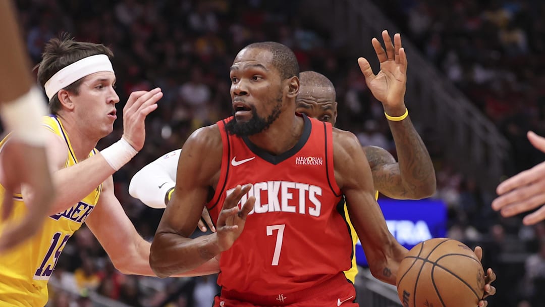 Mar 16, 2026; Houston, Texas, USA; Houston Rockets forward Kevin Durant (7) dribbles the ball as Los Angeles Lakers guard Austin Reaves (15) defends during the first quarter at Toyota Center. Mandatory Credit: Troy Taormina-Imagn Images