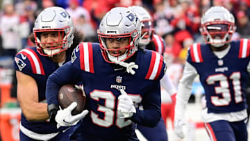Dec 17, 2023; Foxborough, Massachusetts, USA; New England Patriots linebacker Marte Mapu (30) runs back an interception during the first half against the Kansas City Chiefs at Gillette Stadium. Mandatory Credit: Eric Canha-Imagn Images