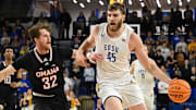 South Dakota State Jackrabbits center Oscar Cluff (45) brings the ball up court