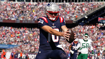 Oct 27, 2024; Foxborough, Massachusetts, USA; New England Patriots quarterback Drake Maye (10) runs the ball for a touchdown against the New York Jets in the first quarter at Gillette Stadium. Mandatory Credit: David Butler II-Imagn Images