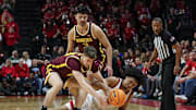 Mar 9, 2025; Piscataway, New Jersey, USA; Rutgers Scarlet Knights guard Dylan Harper (2) and Minnesota Golden Gophers guard Brennan Rigsby (24) battle for the ball in front of forward Dawson Garcia (3) during the first half at Jersey Mike's Arena. Mandatory Credit: Vincent Carchietta-Imagn Images