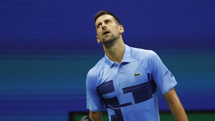 Aug 26, 2024; Flushing, NY, USA; Novak Djokovic (SRB) reacts after missing a shot against Radu Albot (MDA)(not pictured) in a men's singles match on day one of the 2024 U.S. Open tennis tournament at USTA Billie Jean King National Tennis Center. Mandatory Credit: Geoff Burke-Imagn Images