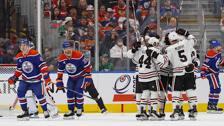 Oct 12, 2024; Edmonton, Alberta, CAN; The Chicago Blackhawks celebrate a goal scored by  forward Philipp Kurashev (23) during the first period against the Edmonton Oilers at Rogers Place. Mandatory Credit: Perry Nelson-Imagn Images