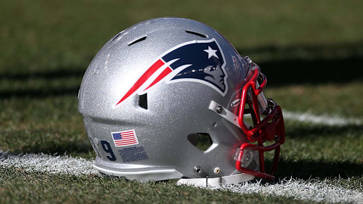 January 19, 2014; Denver, CO, USA; New England Patriots helmet on field before the 2013 AFC Championship football game against the Denver Broncos at Sports Authority Field at Mile High. Mandatory Credit: Mark J. Rebilas-Imagn Images January 19, 2014; Denver, CO, USA; New England Patriots helmet on field before the 2013 AFC Championship football game against the Denver Broncos at Sports Authority Field at Mile High. Mandatory Credit: Mark J. Rebilas-Imagn Images