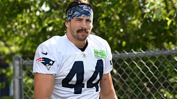 Former New England Patriots tight end Dalton Keene (44) walks to the practice field at the Patriots' training camp at Gillette Stadium. 