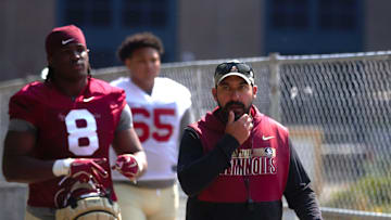 FSU football players and coaches walk into the first spring practice of the spring season on Wednesday, March 19, 2025