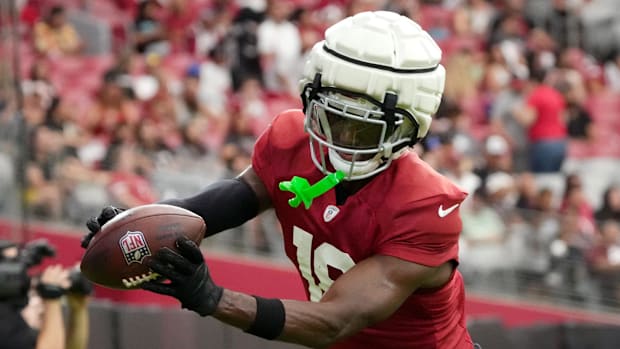 Arizona Cardinals receiver Marvin Harrison Jr. (18) catches a pass in the end. zone during training camp 