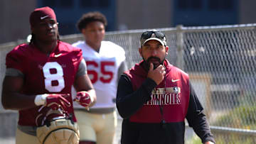 FSU football players and coaches walk into the first spring practice of the spring season on Wednesday, March 19, 2025