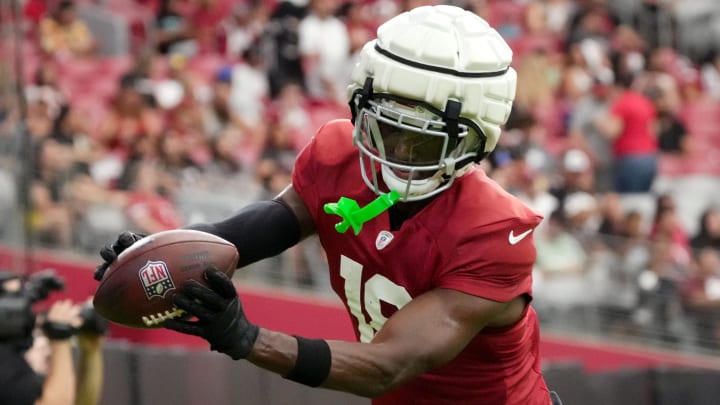 Arizona Cardinals receiver Marvin Harrison Jr. (18) catches a pass in the end. zone during training camp at State Farm Stadium in Glendale, Ariz., on Saturday, Aug. 3, 2024.