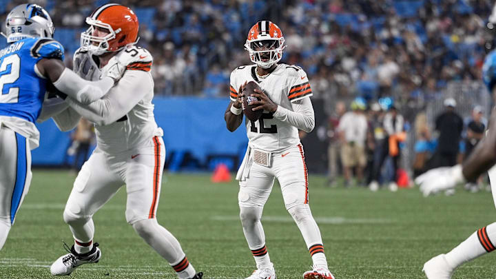 Cleveland Browns quarterback Shedeur Sanders looks downfield for a receiver against the Carolina Panthers in an NFL game Cleveland Browns quarterback Shedeur Sanders looks downfield for a receiver against the Carolina Panthers in an NFL game