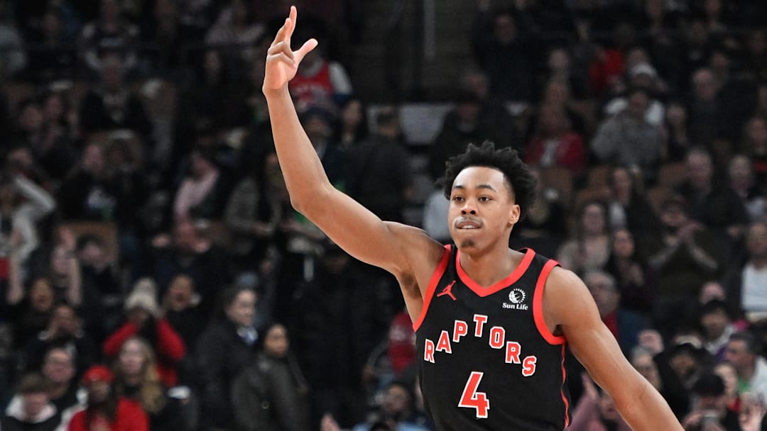 Dec 23, 2023; Toronto, Ontario, CAN;  Toronto Raptors forward Scottie Barnes (4) reacts after making a three point basket against the Utah Jazz in the first half at Scotiabank Arena. Mandatory Credit: Dan Hamilton-Imagn Images