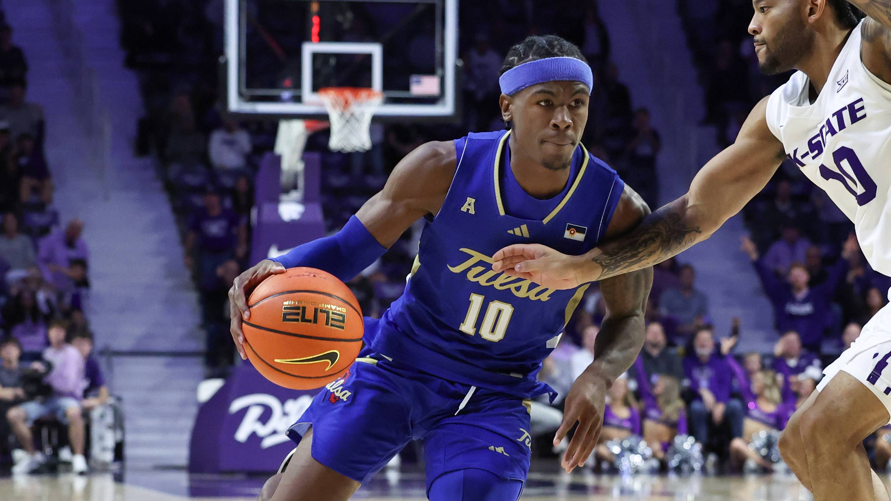 Nov 17, 2025; Manhattan, Kansas, USA; Tulsa Golden Hurricane guard Tylen Riley (10) is guarded by Kansas State Wildcats guard David Castillo (10) during the second half at Bramlage Coliseum. Mandatory Credit: Scott Sewell-Imagn Images | IMAGN IMAGES via Reuters Connect