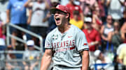 Arkansas Razorbacks starting pitcher Gage Wood celebrates completing a no-hitter at the College World Series.