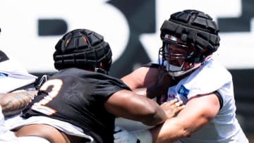 Cincinnati Bengals center Ben Brown (62) and Cincinnati Bengals defensive tackle Domenique Davis