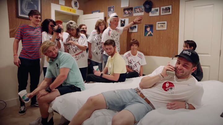 Quarterback Baker Mayfield hilariously recreates Brett Favre's draft day photo in 2018 draft on April 26, 2018.