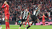 Virgil van Dijk (left) can't look on as Alexander Isak goes to celebrate Newcastle United's second goal of the final.