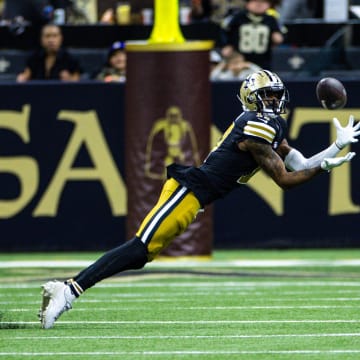 New Orleans Saints wide receiver A.T. Perry (17) dives to catch a pass against the Carolina Panthers