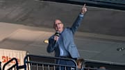 Apr 15, 2025; Saint Paul, Minnesota, USA; The Minnesota Gophers head coach Bob Motzko leads the crowd in a “Let’s play hockey” cheer before the game between the Minnesota Wild and Anaheim Ducks at Xcel Energy Center. Mandatory Credit: Matt Blewett-Imagn Images