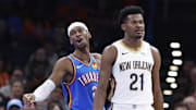 Nov 13, 2024; Oklahoma City, Oklahoma, USA; Oklahoma City Thunder guard Shai Gilgeous-Alexander (2) gestures from behind New Orleans Pelicans center Yves Missi (21) after a play against the New Orleans Pelicans during the second half at Paycom Center. Mandatory Credit: Alonzo Adams-Imagn Images