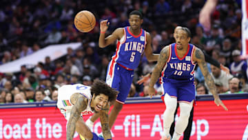 Jan 29, 2025; Philadelphia, Pennsylvania, USA; Philadelphia 76ers guard Kelly Oubre Jr. (9) looses control of the ball while dribbles against Sacramento Kings forward DeMar DeRozan (10) and guard De'Aaron Fox (5) during the third quarter at Wells Fargo Center. Mandatory Credit: Bill Streicher-Imagn Images