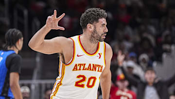 Feb 20, 2025; Atlanta, Georgia, USA; Atlanta Hawks forward Georges Niang (20) reacts after making a three point shot against the Orlando Magic during the first half at State Farm Arena. Mandatory Credit: Dale Zanine-Imagn Images