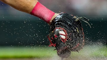 Cincinnati Reds catcher Tyler Stephenson squeezes a pitch in the dirt in the eighth inning of the MLB interleague game between the Cincinnati Reds and the Minnesota Twins.