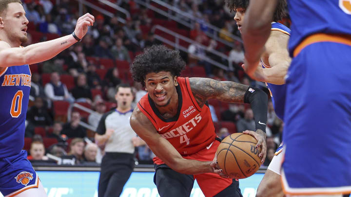 Feb 12, 2024; Houston, Texas, USA; Houston Rockets guard Jalen Green (4) attempts to control the ball during the first quarter against the New York Knicks at Toyota Center. Mandatory Credit: Troy Taormina-USA TODAY Sports