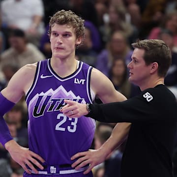 Nov 17, 2023; Salt Lake City, Utah, USA; Utah Jazz forward Lauri Markkanen (23) and head coach Will Hardy speak while the Phoenix Suns shoot free throws in the fourth quarter at Delta Center. Mandatory Credit: Rob Gray-Imagn Images