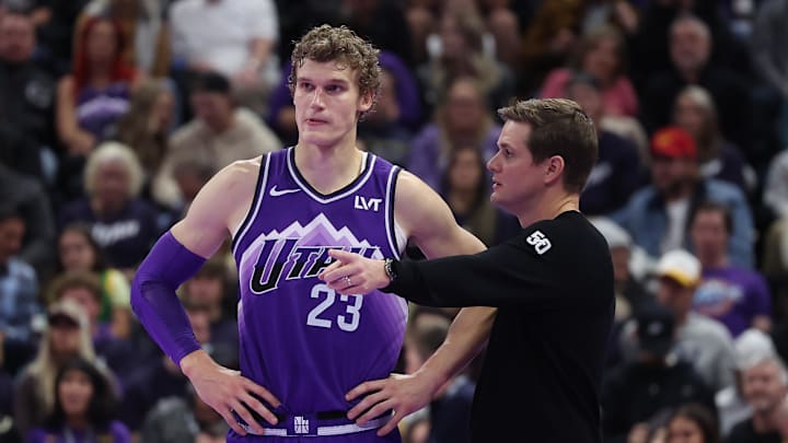 Nov 17, 2023; Salt Lake City, Utah, USA; Utah Jazz forward Lauri Markkanen (23) and head coach Will Hardy speak while the Phoenix Suns shoot free throws in the fourth quarter at Delta Center. Mandatory Credit: Rob Gray-Imagn Images