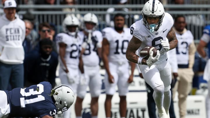 Penn State wide receiver Harrison Wallace III runs with the ball after a catch during the Blue-White Game at Beaver Stadium. 